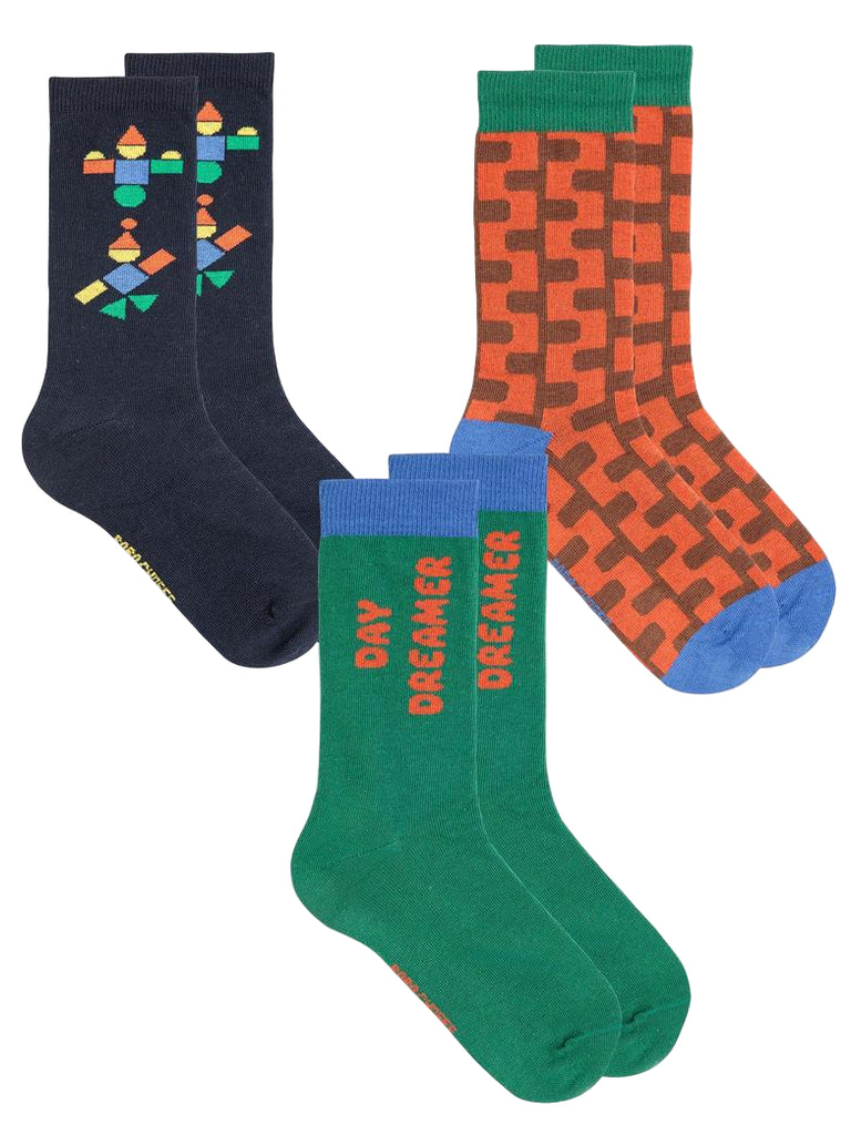 Three pairs of colorful socks with geometric patterns on a white background