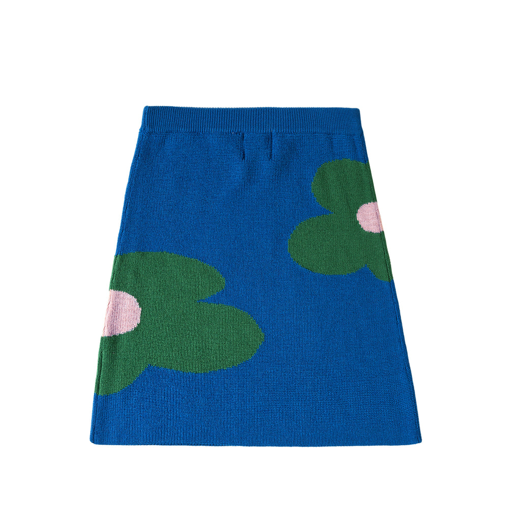 Blue skirt with green flower patterns on a white background