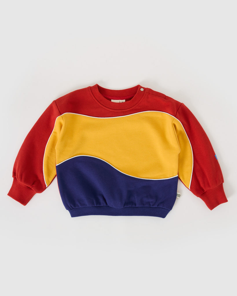 Color-blocked sweatshirt with red, yellow, and blue sections on a white background
