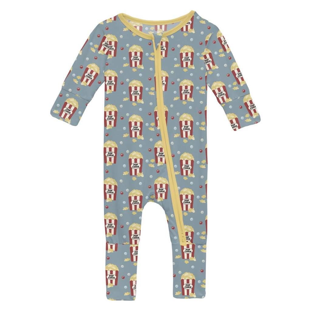 Children's onesie with popcorn pattern on a light blue background