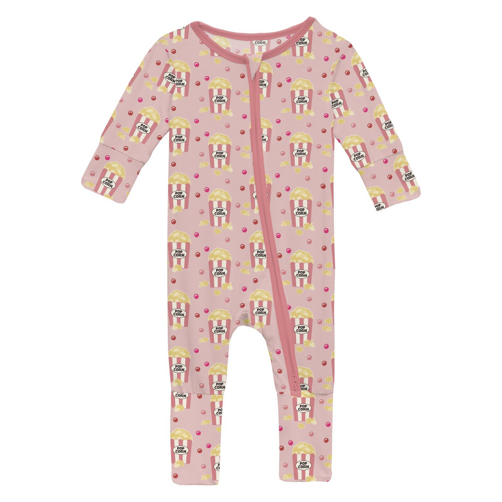 Baby onesie with popcorn pattern on a pink background