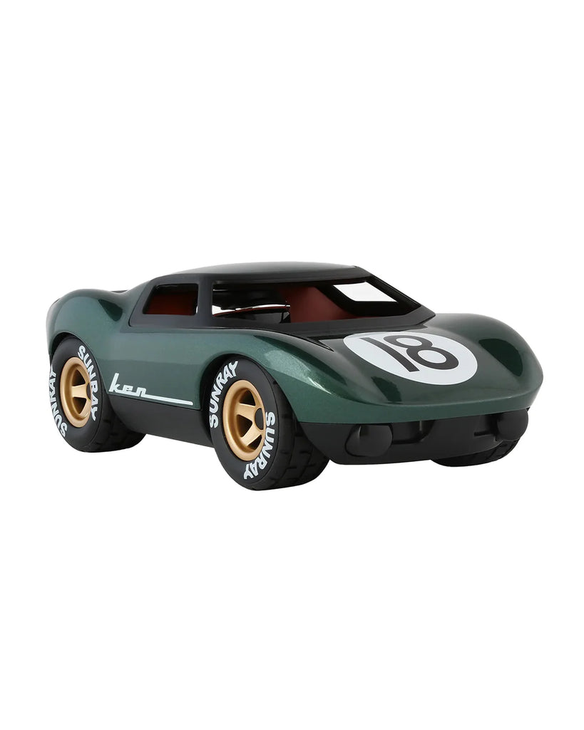 Model car with a green body and gold wheels on a white background