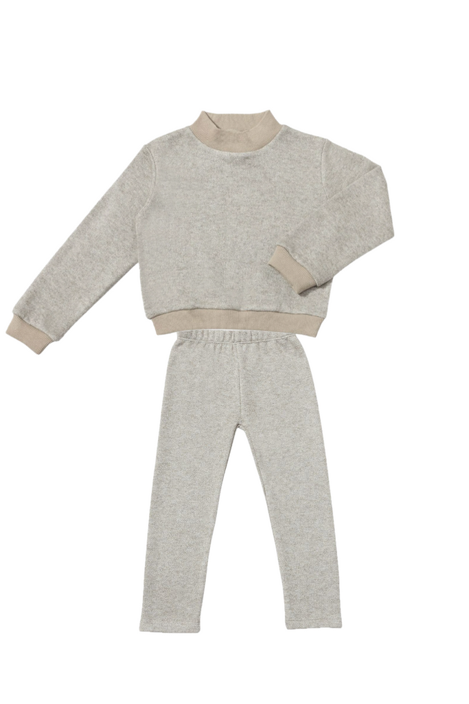 Light gray sweater and pants set on a white background