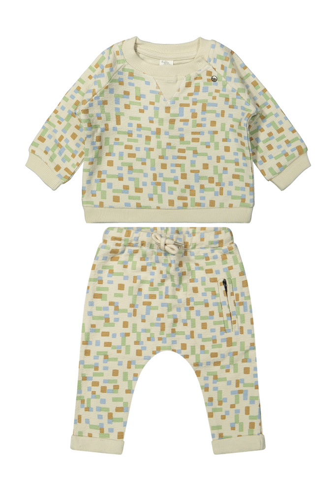 Baby outfit with patterned shirt and pants on a white background